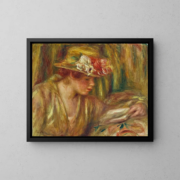 en kvinnobyst i hatt som läser med huvudet vänd åt höger - Pierre-Auguste Renoir — inramlat konstverk på väggen