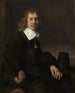 En ung man som sitter vid ett bord, kanske Govaert Flinck - Rembrandt van Rijn — vy av konstverket