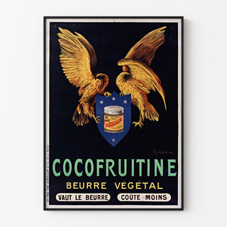 Vintageaffisch Cocofruitine, vegetabiliskt smör, i tunn ram på en ljus vägg.