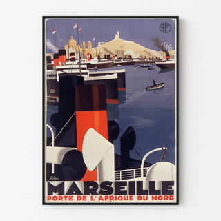 Vintageaffisch Marseille, Porte de l’Afrique du Nord, uppsatt i en tunn ram på en ljus vägg.