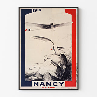 Vintageaffisch Nancy, meeting d’aviation, i en tunn ram på en ljus vägg.