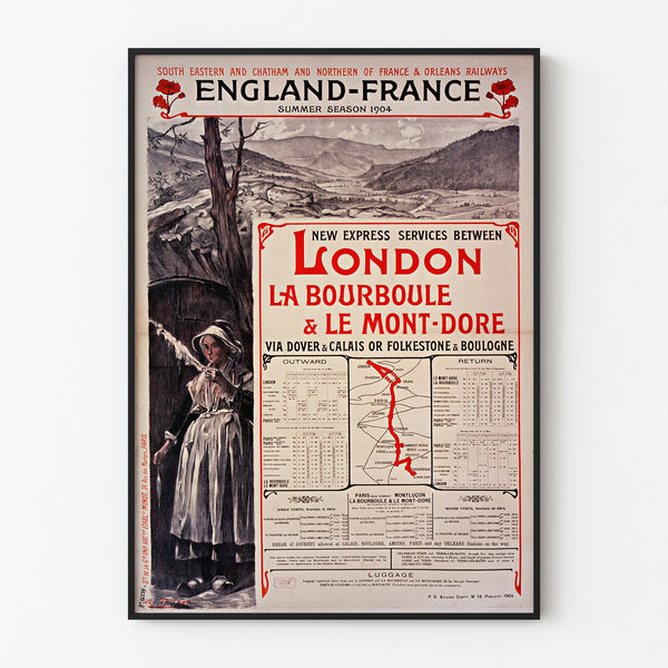 Vintageaffisch South Eastern, England-France, visad i en tunn ram på en ljus vägg.
