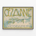 Vintageutställningsposter av Cézanne med lövdekoration — inramlat konstverk på väggen
